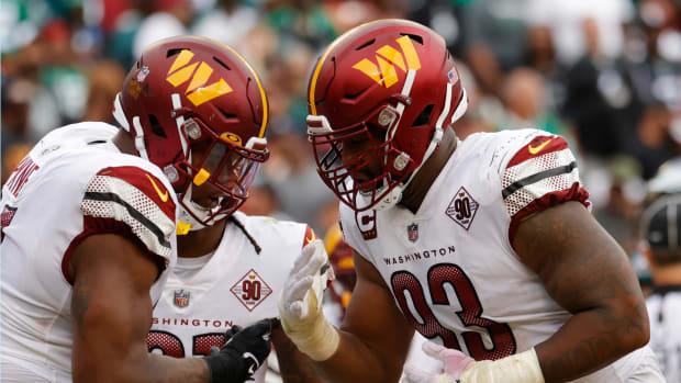 Washington Commanders defensive tackle Daron Payne (94) celebrates with Commanders defensive tackle Jonathan Allen (93) after a safety against the Philadelphia Eagles at FedExField.